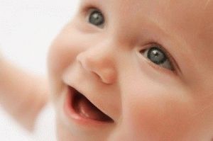 when the child begins to smile consciously